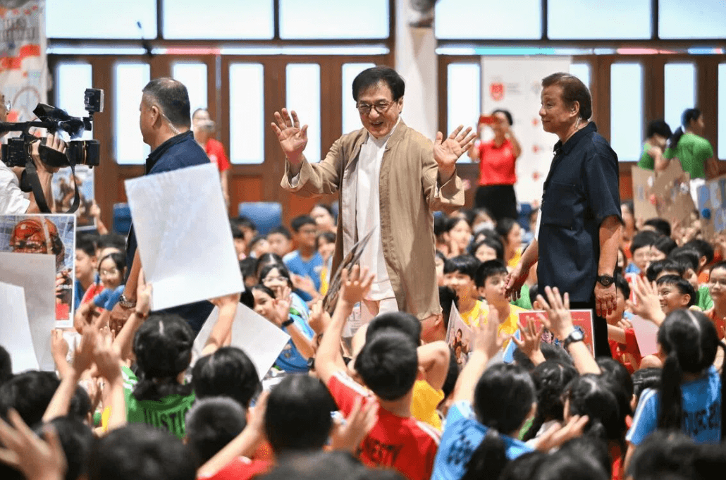 ‘Help others when you’re successful one day’: Action star Jackie Chan encourages pupils at Singapore school