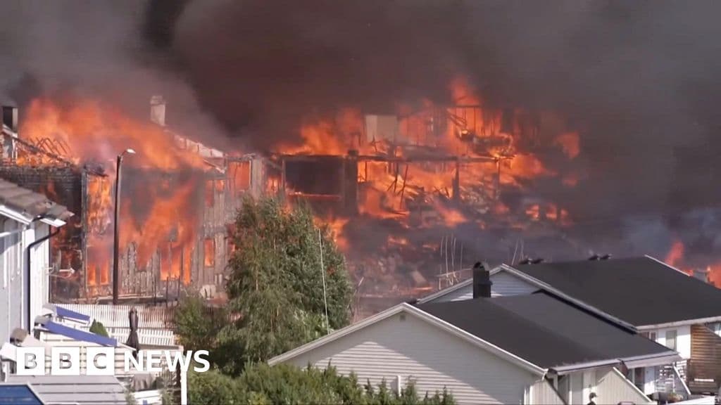 Watch: Helicopters dump water as huge Norway fire destroys homes